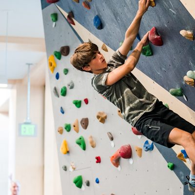 Guest climbing on the bouldering wall at Mt Van Hoevenberg in Lake Placid, NY.