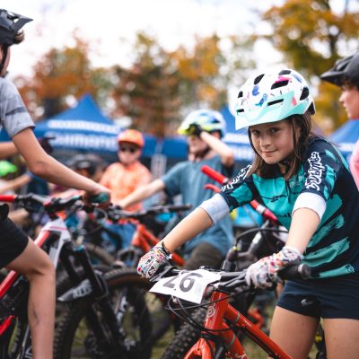 a group of young bikers at the UCI world cup event in lake placid.